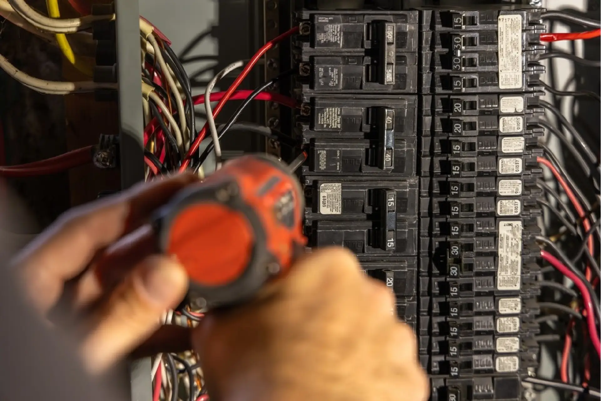 Professional residential electrical panel upgrade in Fort Wayne by licensed electrician Home Enterprises Inc., showing organized modern wiring connections.