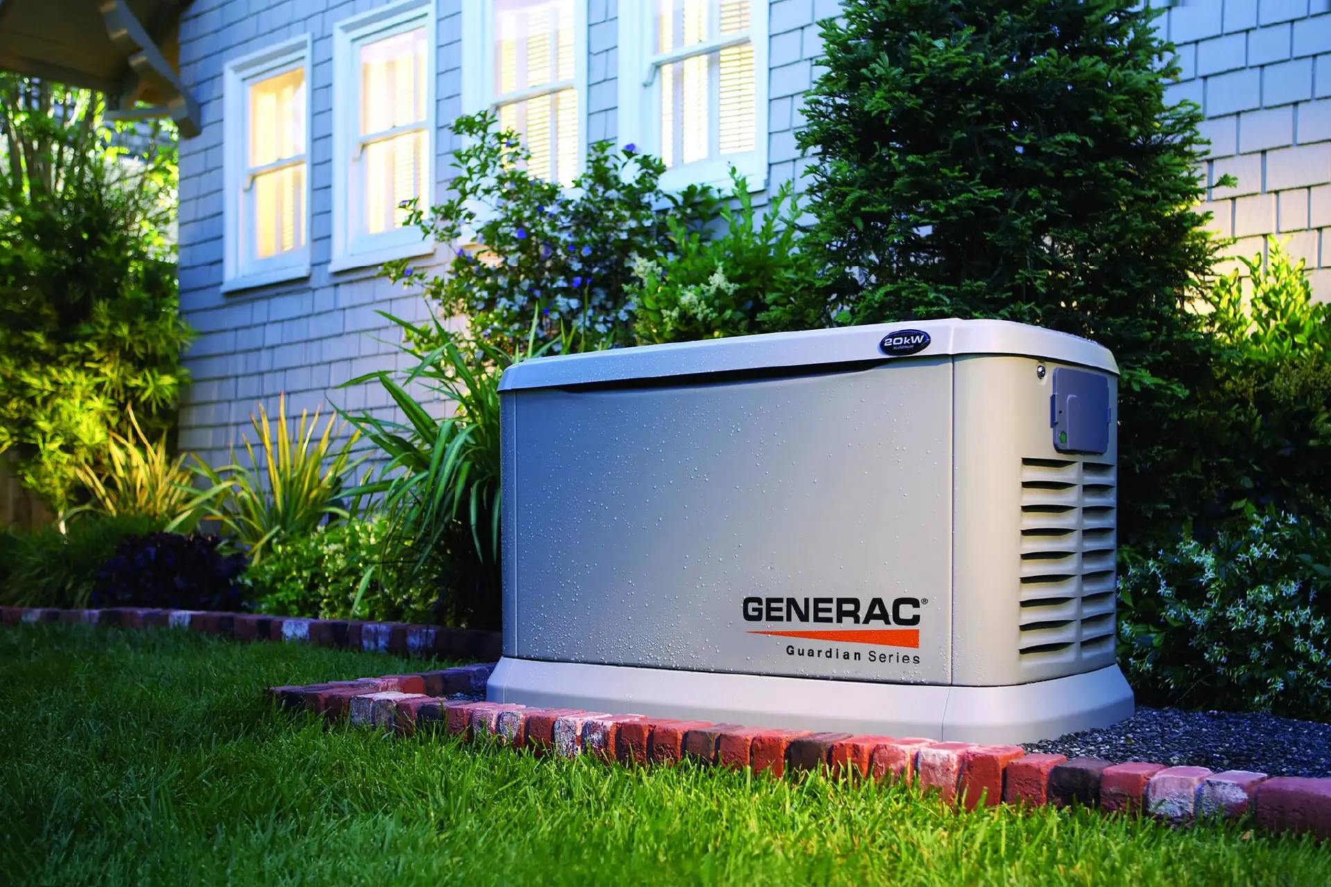Professional residential standby generator installation in Fort Wayne by licensed electrical contractor Home Enterprises Inc., featuring a Generac home generator on a gravel pad next to a house.